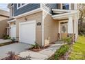 Close-up of a charming home featuring a stone-accented entryway and attached garage, landscaped for curb appeal at 2350 Hedgecliff Rd, Kannapolis, NC 28025