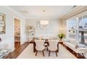 Elegant dining room featuring hardwood floors, a modern chandelier, and stylish decor at 245 Pine Eagle Dr, Rock Hill, SC 29732