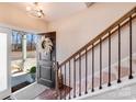 Welcoming foyer with hardwood floors, a staircase with iron balusters, and a view of the front door at 245 Pine Eagle Dr, Rock Hill, SC 29732