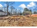 Picture of a construction site surrounded by tall trees and with a home structure beginning to take shape at 265 Duke Dr, Salisbury, NC 28146
