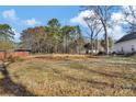 Picture of a cleared lot surrounded by tall trees and with the foundation of a home beginning to take shape at 265 Duke Dr, Salisbury, NC 28146