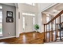 Grand foyer with soaring ceilings, hardwood floors, and staircase at 341 Fischer Rd, Fort Mill, SC 29715