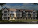 Charming new construction townhome featuring a mix of siding and brick exterior at 348 Catawba Ave, Davidson, NC 28036
