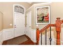 Bright foyer featuring a beautiful staircase, elegant trim, and a well-lit entrance at 599 Sixth Baxter Xing, Fort Mill, SC 29708