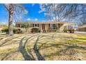 Traditional brick home with a covered carport and mature trees at 827 Lakeside Cir, Lancaster, SC 29720
