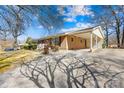 Charming home featuring a covered carport and well-maintained landscaping at 827 Lakeside Cir, Lancaster, SC 29720