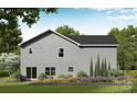 The backyard offers lush landscaping, a patio with sliding glass doors, and an expansive lawn at 1150 Nations Dr, Charlotte, NC 28217