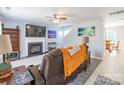Inviting living room featuring a fireplace, TV, and view into the dining room at 1515 Kingdom Way, Indian Land, SC 29707