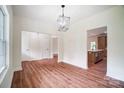 Open dining room featuring wood floors and views to the kitchen at 2194 Lannie Ln, Rock Hill, SC 29730