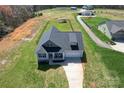 Aerial view of property showing the home, driveway, and surrounding landscape at 2504 Hovis Rd, Lincolnton, NC 28092