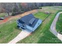 Birds eye view of the property showcasing the home, long driveway, and fenced yard at 2504 Hovis Rd, Lincolnton, NC 28092