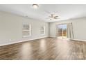 The light-filled living area is enhanced by wood floors and features large windows and access to the outdoor deck at 2504 Hovis Rd, Lincolnton, NC 28092