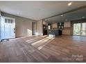 Bright living room showcasing an open layout, recessed lighting, and hardwood flooring at 3094 Hollywood Dr, Gastonia, NC 28052