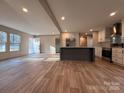 Open-concept area with hardwood floors, recessed lighting, and kitchen with island at 3094 Hollywood Dr, Gastonia, NC 28052