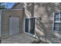 Exterior view featuring siding, a sliding glass door and concrete patio area at 3258 Summercroft Ln, Charlotte, NC 28269