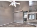 An inviting living room with carpet, a ceiling fan and an open view into the kitchen at 3258 Summercroft Ln, Charlotte, NC 28269