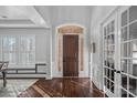 Bright foyer with rich wood floors, archway and a paneled front door at 3608 Mcpherson St, Waxhaw, NC 28173