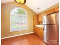 This kitchen offers stainless steel appliances, wood floors and lots of natural light at 4580 Antelope Ln, Charlotte, NC 28269