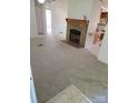 Cozy living room with a stone fireplace and open layout to the kitchen at 630 Pinelake Dr, Troy, NC 27371