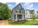 Attractive two-story home with a covered front porch and well-maintained landscaping at 110 Walters St, Huntersville, NC 28078