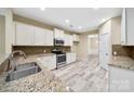 Modern kitchen with granite countertops, stainless steel appliances, and white cabinets at 119 Front Porch Dr # 46, Rock Hill, SC 29732