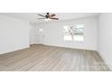 Sun-filled living room with ample space featuring luxury vinyl plank flooring at 230 Georgia Sw St, Concord, NC 28025