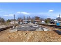 New home foundation is visible in this construction site surrounded by neighborhood homes at 425 Messner St, Salisbury, NC 28144