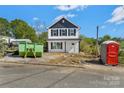 New two-story home with white siding and black accents sits ready for landscaping at 425 Messner St, Salisbury, NC 28144