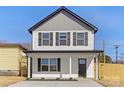 Charming two-story home featuring a modern gray and white color scheme and a well-manicured front yard at 425 Messner St, Salisbury, NC 28144