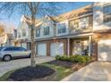 Charming townhome featuring a brick facade, single-car garage, manicured front yard, and inviting entrance at 4507 Antelope Ln, Charlotte, NC 28269
