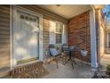 Inviting front porch featuring a seating area, decorative welcome mat, and elegant white door at 4507 Antelope Ln, Charlotte, NC 28269