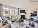 Bright living room featuring a fireplace, large windows and an open concept layout at 4625 Potters Wheel Dr, Fort Mill, SC 29715