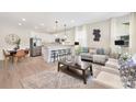 Open-concept living space with modern decor, hardwood floors, and ample natural light at 5404 Maplewood Ln, Charlotte, NC 28227