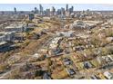 Drone shot showing property's proximity to uptown, businesses, roads, and green spaces within the city skyline at 701 S Torrence St, Charlotte, NC 28204
