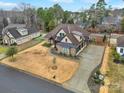 Sprawling home with lush green trees, a long driveway, and manicured lawn at 894 Abilene Ln, Fort Mill, SC 29715
