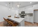 Bright kitchen with stainless appliances, quartz countertops, and a stylish island with seating at 116 Shay Crossing Rd # 2P, Salisbury, NC 28144