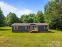 Spacious home featuring lush green lawn and ample natural surroundings at 1254 Raxter Rd, Edgemoor, SC 29712