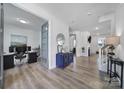 A view from the entryway into an office, hallway, living room and stairwell of the home at 16709 Mckee Rd, Charlotte, NC 28278