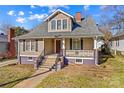 Charming two-story home with a welcoming front porch and classic architectural details at 214 Maupin Ave, Salisbury, NC 28144