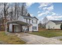 Charming two-story home with carport and landscaped front yard at 2444 Fabyan Ln, Charlotte, NC 28262