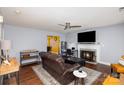 Comfortable living room with a fireplace, TV, and open kitchen view at 2444 Fabyan Ln, Charlotte, NC 28262