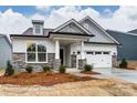 New construction single-Gathering home with stone accents, covered entryway, and attached two car garage at 3009 Bent Willow Dr # 160, Indian Trail, NC 28079