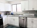 Bright kitchen features stainless steel appliances, white cabinetry, and granite countertops at 3240 Heathstead Pl, Charlotte, NC 28210