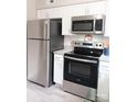 Stainless steel refrigerator and stove in the kitchen of this home at 3240 Heathstead Pl, Charlotte, NC 28210