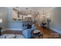Bright living room with hardwood floors, an eat-in kitchen, and plenty of seating at 435 Beacon Nw St, Concord, NC 28027