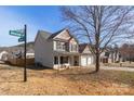 Two-story home featuring a two-car garage, traditional siding, and landscaped yard at 5023 Wicklow Dr, Gastonia, NC 28054