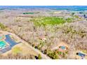 A high angle aerial view of the house and it's surrounding acreage at 809 Liberty Rd, Gold Hill, NC 28071