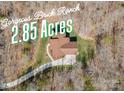 Birds eye view showcasing a brick ranch home on 2.85 acres surrounded by woods at 809 Liberty Rd, Gold Hill, NC 28071