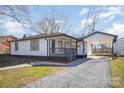 A charming home with white siding, a gravel driveway, and a convenient carport at 922 Grace Ave, Kannapolis, NC 28083