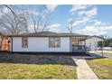 Exterior view of home featuring white siding, a gray porch, and a carport at 922 Grace Ave, Kannapolis, NC 28083